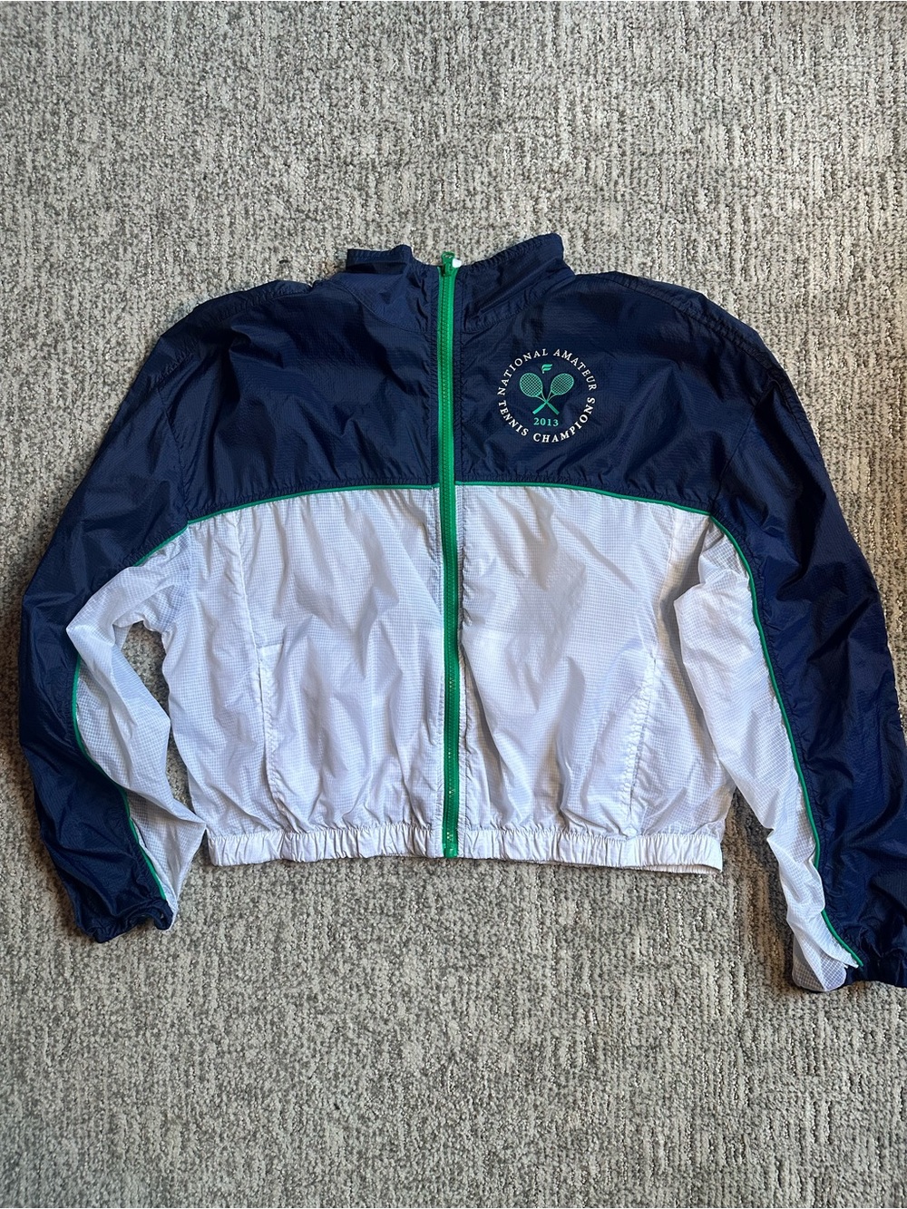 Fabletics Navy and White Cropped Tennis Windbreaker Jacket with Green Trim